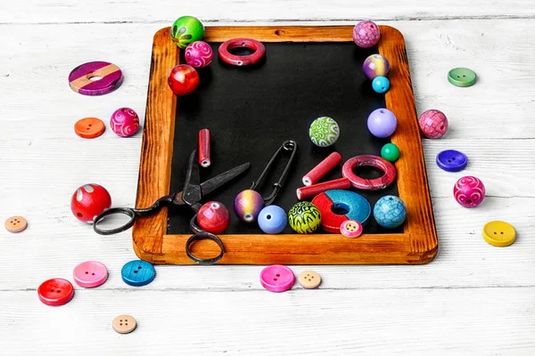 Beads for art on the chalk board — Stock Photo, Image