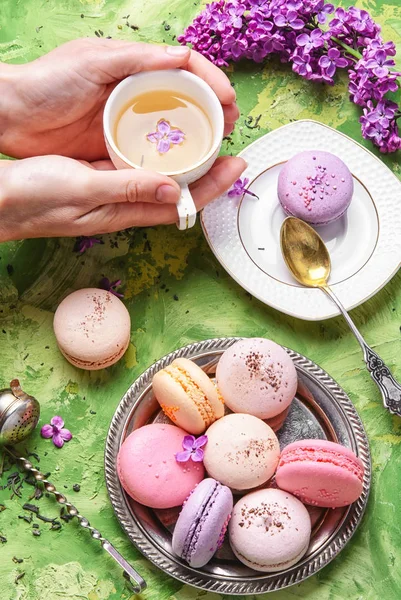 Sweet french macaroons and tea — Stock Photo, Image