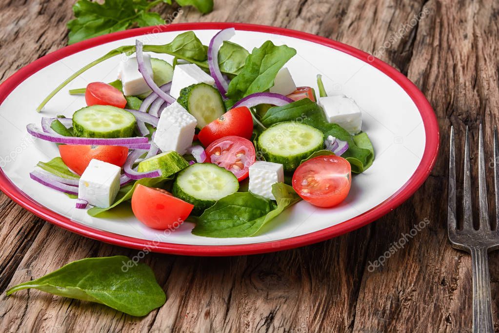 salad with spinach, cheese and tomato