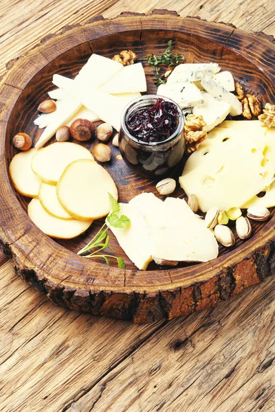 Cheese platter on wooden tray — Stock Photo, Image