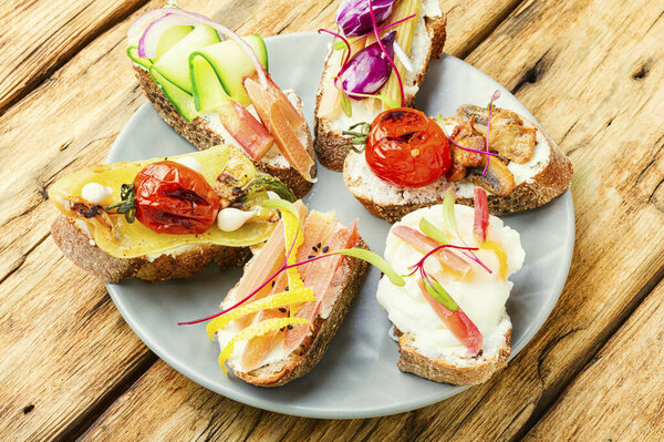 Set of delicious Italian bruschettas with grilled vegetables.