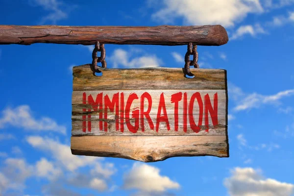 Immigration motiverande fras tecken Stockfoto