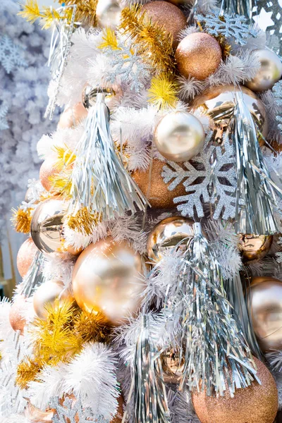 Christmas baubles hanging from white christmas tree — Stock Photo, Image