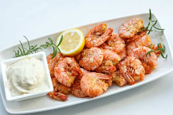 Row tiger shrimp with lemon on white — Stock Photo, Image