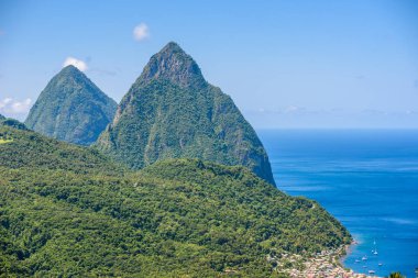 Gros and Petit Pitons near village Soufriere on Caribbean island Saint Lucia clipart