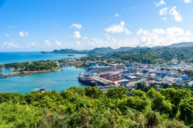 Castries, Saint Lucia - Tropical coast with port and ships on Caribbean island of St. Lucia. clipart