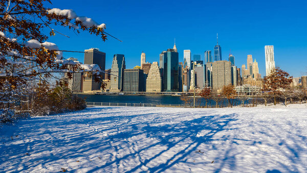 Lower Manhattan skyline panorama in snowy winter time