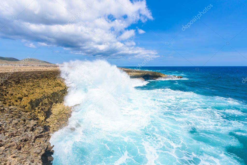 Amazing crashing waves at coastline of Caribbean island Curacao.