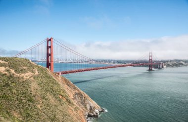 Golden Gate Bridge with the skyline of San Francisco in the background on a beautiful sunny day with blue sky and clouds in summer - Panoramic view from Battery Spencer - San Fancisco Bay Area,  Golden Gate National Recreation Area, California, USA clipart