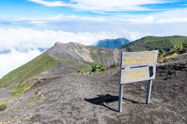 Signboard at Irazu volcano with crater lake in Costa Rica. clipart