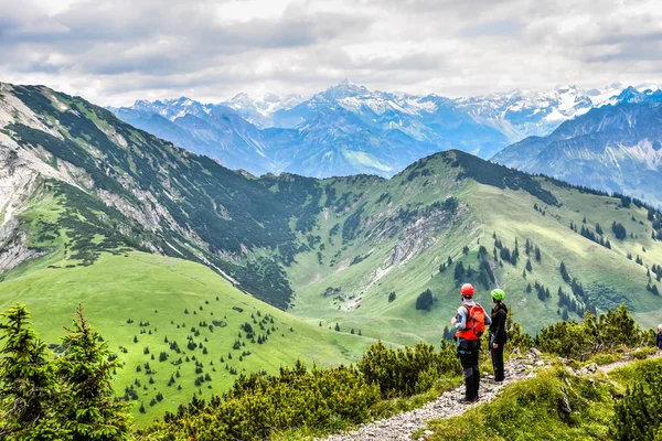 Hikers in beautiful landscape of Alps in Germany - Hiking in the mountains