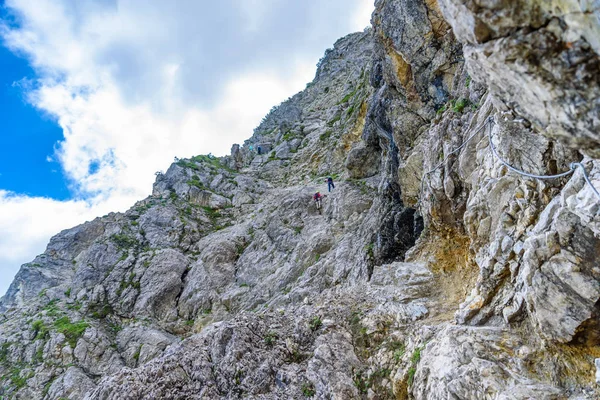 Hiker climbing in the mountain of Alps, Europe