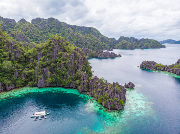 Aerial view of Twin Lagoon on paradise island with sharp limestone rocks, tropical travel destination - Coron, Palawan, Philippines.