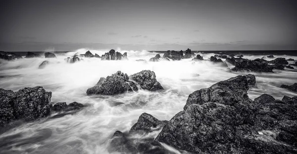 stock image Porto Moniz - Long exposure of rocks and waves at vulcanic coast - beautiful landscape scenery of Madeira Island, Portugal