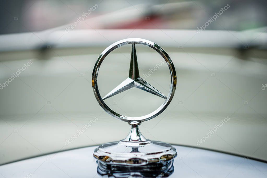 PAAREN IM GLIEN, GERMANY - JUNE 03, 2017: The famous three-beam star of Mercedes-Benz. Hood ornament, close-up. Exhibition 