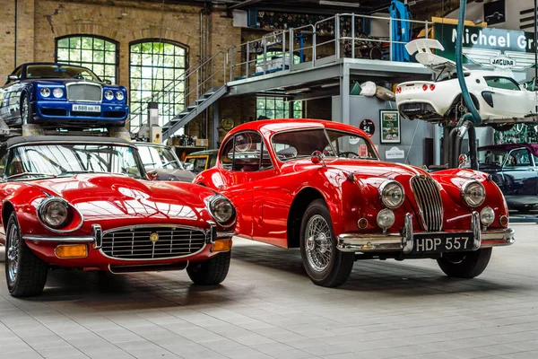 Car workshop for maintenance of classic British car. Center of competence for classic cars and youngtimers - Classic Remise. Stock Picture