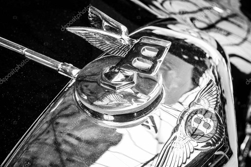 BERLIN - MAY 13, 2017: Hood emblem of the luxury car Bentley. Black and white. Exhibition 