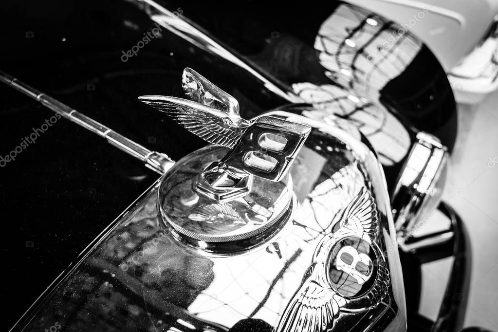 BERLIN - MAY 13, 2017: Hood emblem of the luxury car Bentley. Black and white. Exhibition 