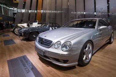 Mercedes-Benz CL 55 AMG (foreground), Mercedes-Benz 300SL (center) and Mercedes Simplex 40PS (background). clipart