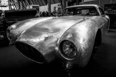 Restoration of the bodywork of the Maserati A6GCS race car. clipart