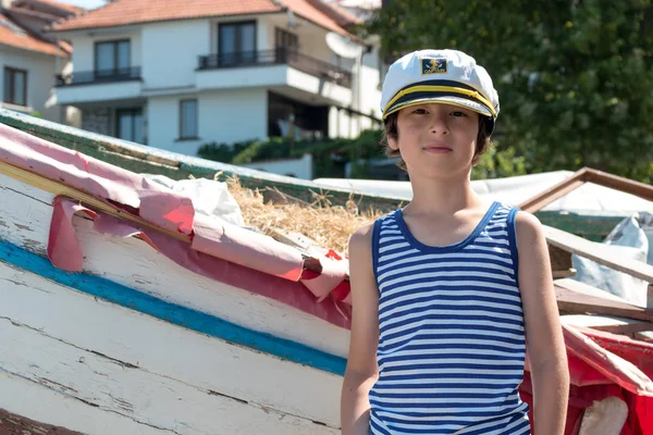 Portrait Boy Striped Shirt Captain Cap Background Old Wooden Boat — Stock Photo, Image