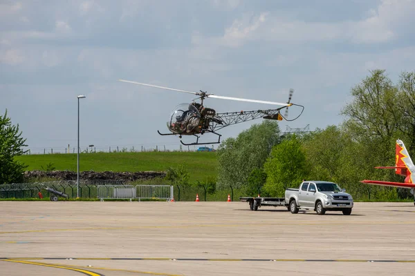 stock image BERLIN, GERMANY - APRIL 27, 2018: Takeoff multipurpose light helicopter Bell 47. Exhibition ILA Berlin Air Show 2018