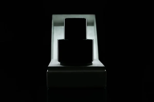 Black bottle perfume.black perfume bottle in a white box.