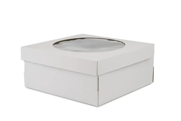 Картонная коробка с круглым окном для торта — стоковое фото