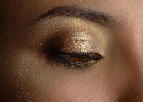 Woman with golden makeup. — Stock Photo, Image