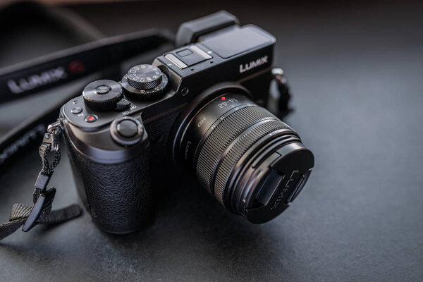 VLADIVOSTOK, RUSSIA - JULY 15, 2016: Studio shot of camera Panasonic GX8 on a dark background. The camera features a newly developed 20 megapixel sensor.