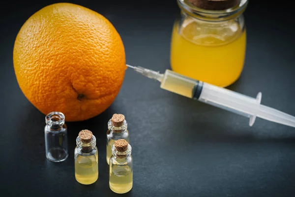 Orange Syringe Injection Colored Liquid — Stock Photo, Image