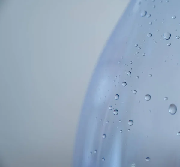 stock image Drops on a glass with selective focus. Color toned image.