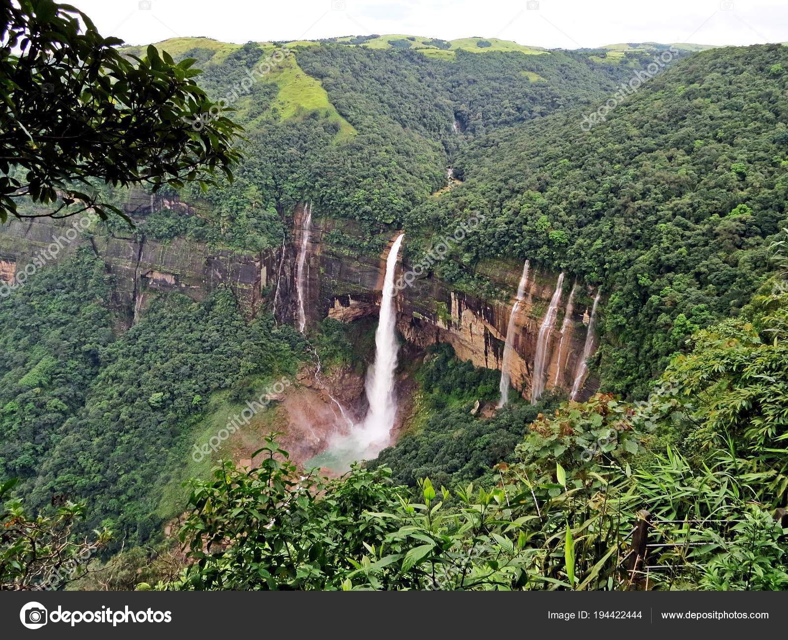 waterfall streams falling from mountain top covered with green forests at  day image is taken at Nohkalikai Falls cherrapunji meghalaya india. it is  th Stock Photo - Alamy