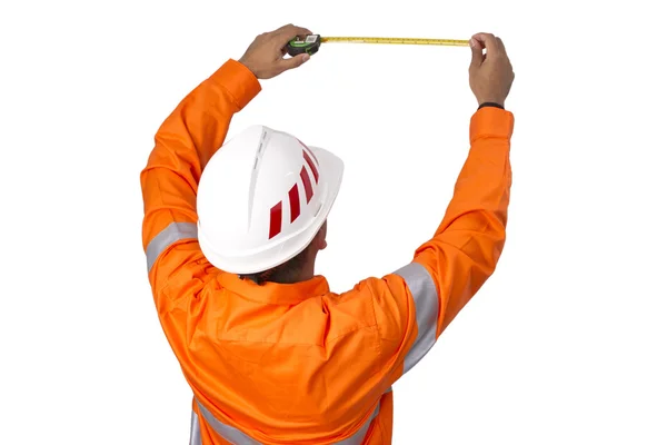Supervisor com fita métrica vestindo camisa de alta visibilidade em um — Fotografia de Stock