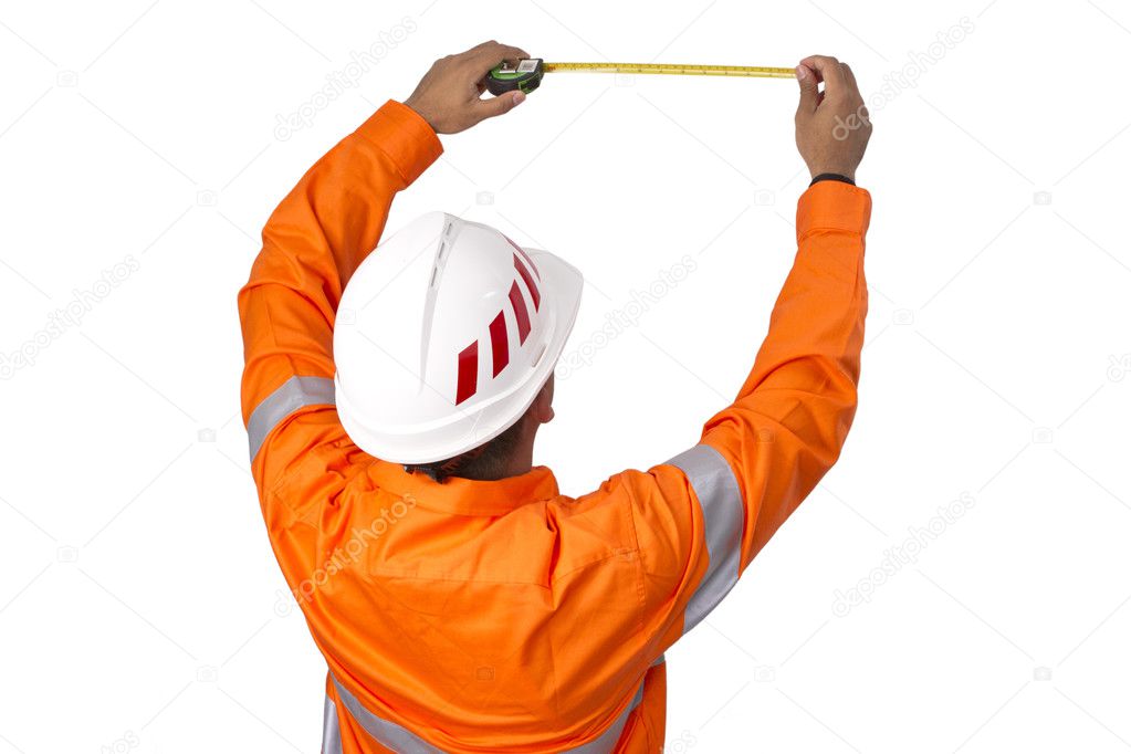 Supervisor with tape measure wearing high visibility shirt on a 