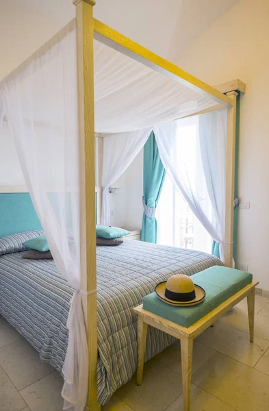 Elegant Canopy Bed Surrounded with White Sheer Fabric — Stock Photo, Image