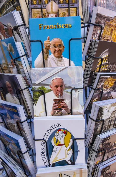 Vatican City, Italy - September 25, 2016: Rack filled with postcards and booklets with photos of Pope Francis' smiling face. — Stock Photo, Image