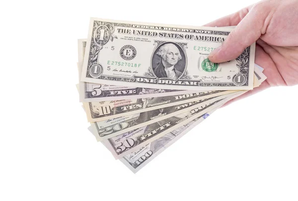 Mano sosteniendo las facturas del dólar estadounidense en varias denominaciones — Foto de Stock
