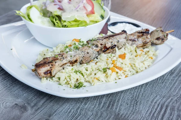 Greek Pork Soulaki Served on a Bed of Rice — Stock Photo, Image