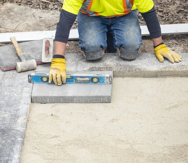 Workman Safety Jacket Laying Patio Pavers Backyard — Stock Photo, Image