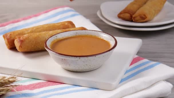 Delicious risoles on the plate with peanut sauce — Stock Video