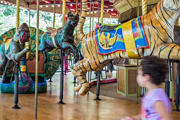 Colorful carousel ready to take children for a ride — Stock Photo, Image