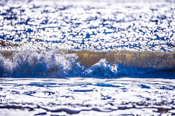 Close up view of beautiful blue ocean wave with white foam — Stock Photo, Image