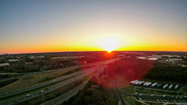 Morning sunrise over highway clover leaf road interchange in nor — Stock Photo, Image