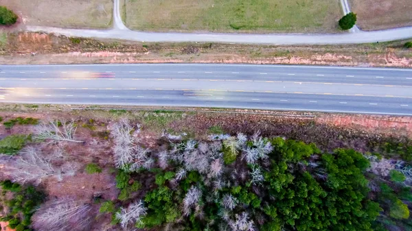 Aerial view over country road  forest and fields — 스톡 사진