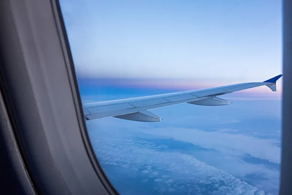 Looking out airplane window in the morning — Stock Photo, Image