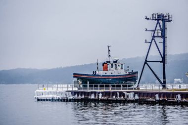 tug boat in the marina in traverse city michigan clipart