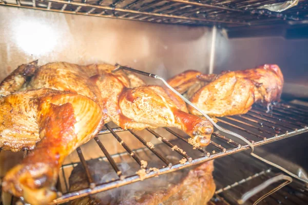 Whole chicken smoked in electric bbq smoker — Stock Photo, Image