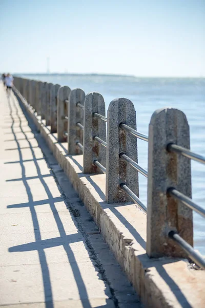 Guear rail and security fence along harbor pier in port — Stock Photo, Image