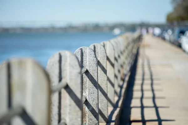 stock image guear rail and security fence along harbor pier in port